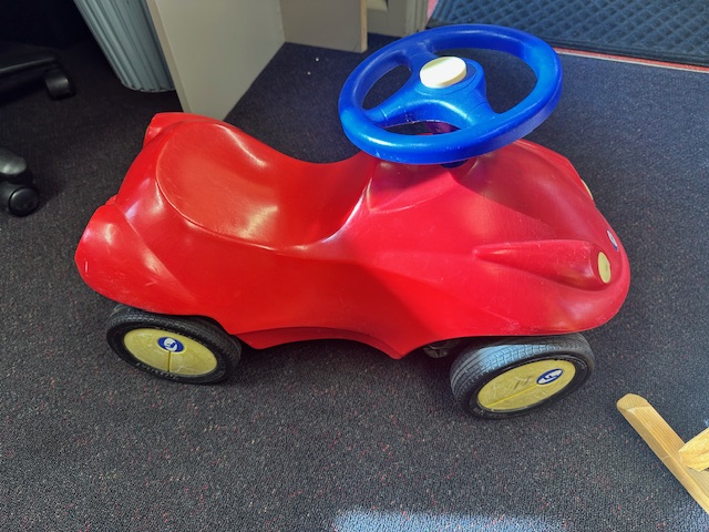 Red Car with Blue Steering Wheel